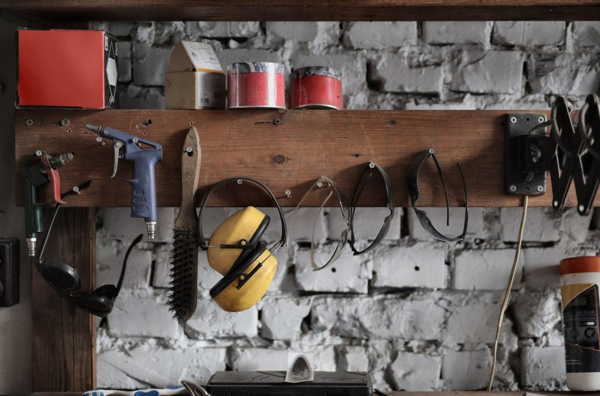Halloween display gear arranged on a workbench in a garage